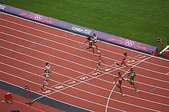 Zieleinlauf Vorlauf 4: Lorène Bazolo (Bahn 2), Feta Ahamada (B. 3), Michelle-Lee Ahye (B. 4), Tatjana Pinto (B. 5), Blessing Okagbare (B. 6), Tianna Madison (B. 7), Nimet Karakus (B. 8), Andreea Ogrăzeanu (B. 9)