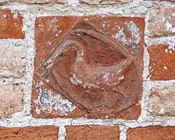 Böddeker’sche Wappen (Schwan im blauen Felde, welcher nach einem Bande schnappt, auf dem das Wort fides[2] zu lesen ist.)