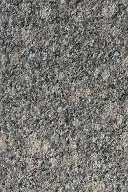Gestockte Steinoberfläche aus Beuchaer Granitporphyr (Muster ca. 25 × 15 cm)