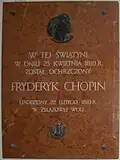 Gedenktafel in der Kirche des Heiligen Rochus und Johannes des Täufers von Brochów, mit dem Schriftzug: In diesem Gotteshaus wurde am 23. April 1810 Fryderyk Chopin getauft geboren am 22. Februar 1810 in Żelazowa Wola .