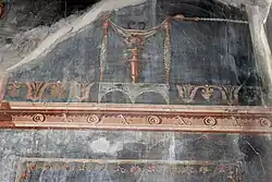 Detail einer schwarzgrundigen Malerei aus der Casa del Salone nero