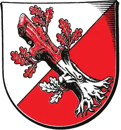 Von Silber und Rot schräglinks geteilt, darauf in vertauschten Farben ein Eichenstumpf (Wahlstedt, DE)