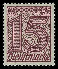 rechteckige Briefmarke der einer großen Zahl „15“ und darunter dem Wort „Dienstmarke“ in rot