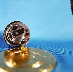 Fig. 14a. Ringgreifer mit Spulengehäuse einer modernen Nähmaschine