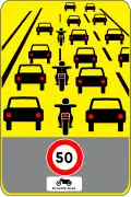Experimentelles Schild: Höchstgeschwindigkeit für Motorräder, die zwischen andere Fahrzeuge fahren (Wörtlich: Inter-files) (2021 bis 2024)