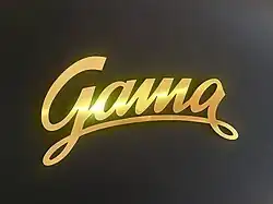 Schriftzug der Uhrenmarke "Gama" aus Bronze