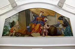 in einer geschwungenen Stuckkartusche ein farbenfrohes Deckengemälde mit Maria im Zentrum