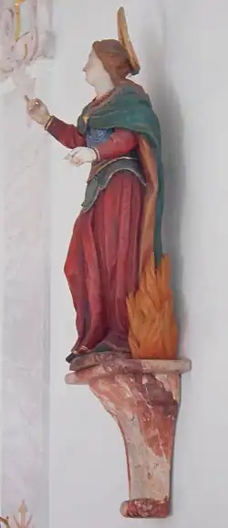 Statue einer Heiligen, wahrscheinlich Thekla (möglicherweise aber auch Afra), an der Südwand des Langhauses