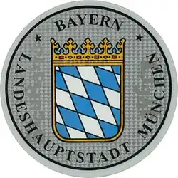 Zulassungsplakette der Landeshaupt­stadt München mit dem bayerischen Staatswappen bis 2014