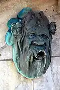 Brunnenmaske am Fluderbrunnen im Schillerpark, Klagenfurt