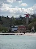 Leuchtturm Eckernförde in der Eckernförder Bucht mit Landeszentrum der DLRG