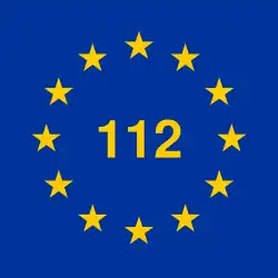 12 gelbe Stern im Kreis, in der Mitte „112“ im gleichen Gelb, blauer Hintergrund