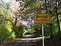 Westliche Ortseinfahrt Westrich am Kirchweg.