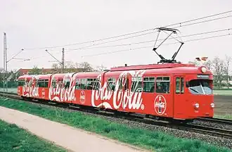 Straßenbahn-Zwölfachser der Rhein-Haardtbahn mit vollflächiger Ganzreklame (2004)