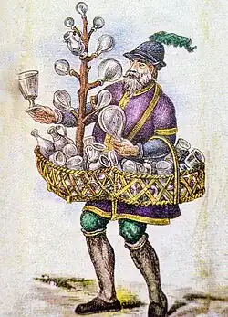 Hausierer aus Gröden mit einer Ladung von holzgeschnitzten Pferden und ein Glasverkäufer