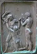 Relief (rechts) auf dem Sockel der Skulptur in Vänersborg
