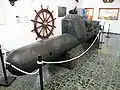 Bemannter Torpedo vom Typ SLC am Eingang des Museums