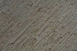 Gebeilte Steinoberfläche aus Obernkirchener Sandstein, Muster ca. 25 × 15 cm