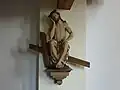 Holzfigur des Heiland in der Rast