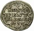 Rentkreuzer von 1737. Beschriftung: "MONTF: / RENT / KREUZER / 1737" in Kartusche.
