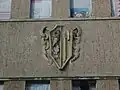 Stadtwappen an der Fassade des Sachsenbades