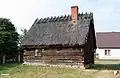 Schurzholz-Gebäude aus dem 18. Jahrhundert mit Reetdach (2010)