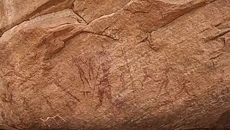 Männer mit Stöcken