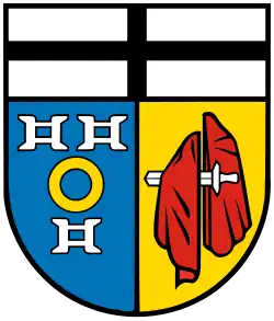 Wappen von Kaarst mit drei Mühleisen im vorderen Feld