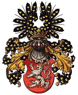 Königreich Böhmen: Oberwappen: Auf goldbekröntem, silbernem Spangenhelm mit schwarz-goldener Helmdecke ein offener schwarzer Flug, jeweils belegt mit goldenen Lindenblättern. Ströhl, 1890